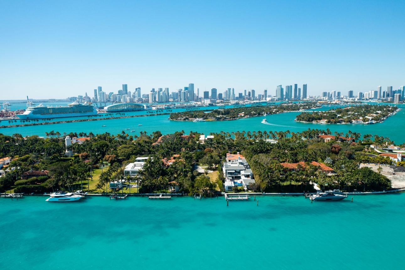 Star Island and Indian Creek single-family estates with the Miami skyline
