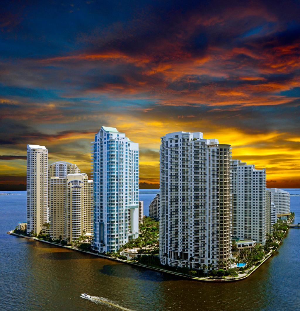 Brickell Key residential towers at sunset over Biscayne Bay
