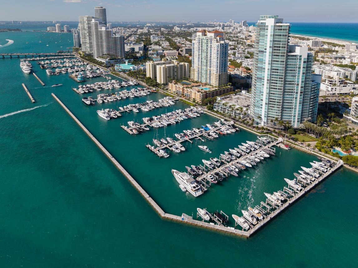 Oceanfront luxury condominium tower in South Beach at sunrise